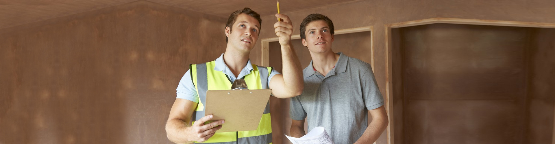 professional construction worker discussing with an adult man smiling